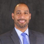 A headshot of Moises Feliz, the AVP of Lending/Office Manager at Ravan City Central Bank .